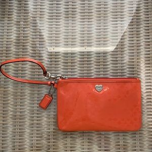 orange coach wristlet